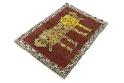 Corner detail of 2000s Persian Gabbeh rug showing border pattern and Wool pile