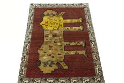 Surface texture of 2000s Persian Gabbeh rug with natural Wool and intricate pattern