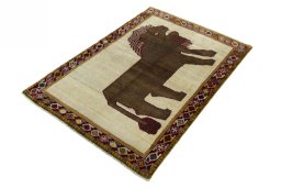 Corner detail of 2000s Persian Gabbeh rug showing border pattern and Wool pile