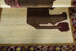 Full view of 2000s Persian Gabbeh rug from Iran / Persia, 156 × 108 cm in Beige tones