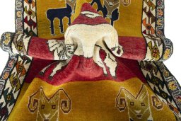 Corner detail of 2000s Persian Gabbeh rug showing border pattern and Wool pile