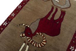 Backside of handmade 2000s Persian Gabbeh rug showing knot structure and weave density