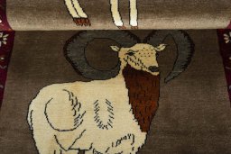 Full view of 2000s Persian Gabbeh rug from Iran / Persia, 218 × 88 cm in Brown tones