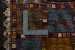 Close-up detail of 2000s Persian Gabbeh rug from Iran / Persia showing Wool weave