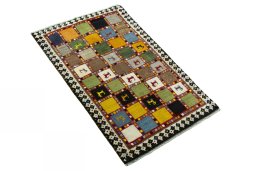 Close-up detail of 2000s Persian Gabbeh rug from Iran / Persia showing Wool weave
