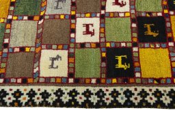 Close-up detail of 2000s Persian Gabbeh rug from Iran / Persia showing Wool weave
