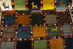 Full view of 2000s Persian Gabbeh rug from Iran / Persia, 124 × 80 cm in Multi Color tones