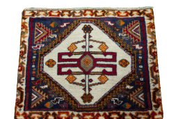 Surface texture of 2000s Persian Gabbeh rug with natural Wool and intricate pattern