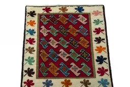 Surface texture of 2000s Persian Gabbeh rug with natural Wool and intricate pattern