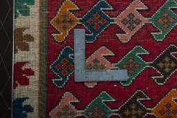 Backside of handmade 2000s Persian Gabbeh rug showing knot structure and weave density