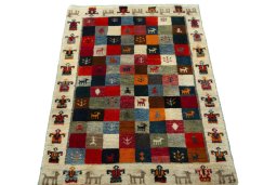 Surface texture of 2000s Persian Gabbeh rug with natural Wool and intricate pattern