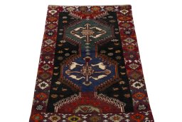 Surface texture of 2000s Persian Gabbeh rug with natural Wool and intricate pattern