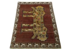 Surface texture of 2000s Persian Gabbeh rug with natural Wool and intricate pattern