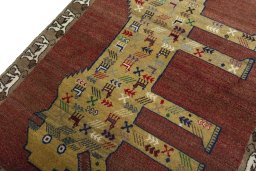 Backside of handmade 2000s Persian Gabbeh rug showing knot structure and weave density