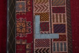 Surface texture of 2000s Persian Gabbeh rug with natural Wool and intricate pattern