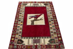 Surface texture of 2000s Persian Gabbeh rug with natural Wool and intricate pattern