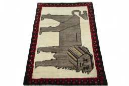 Surface texture of 2000s Persian Gabbeh rug with natural Wool and intricate pattern