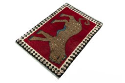 Corner detail of 2000s Persian Gabbeh rug showing border pattern and Wool pile