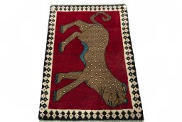 Surface texture of 2000s Persian Gabbeh rug with natural Wool and intricate pattern