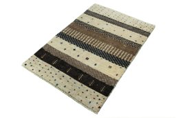 Corner detail of 2000s Persian Gabbeh rug showing border pattern and Wool pile