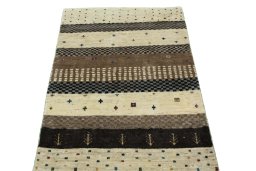 Surface texture of 2000s Persian Gabbeh rug with natural Wool and intricate pattern
