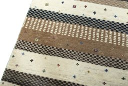 Backside of handmade 2000s Persian Gabbeh rug showing knot structure and weave density