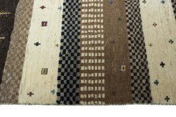 Full view of 2000s Persian Gabbeh rug from Iran / Persia, 128 × 87 cm in Beige tones