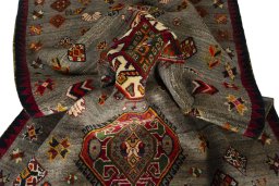 Corner detail of 2000s Persian Gabbeh rug showing border pattern and Wool pile