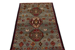 Surface texture of 2000s Persian Gabbeh rug with natural Wool and intricate pattern