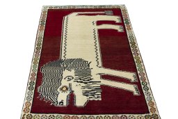 Surface texture of 2000s Persian Gabbeh rug with natural Wool and intricate pattern