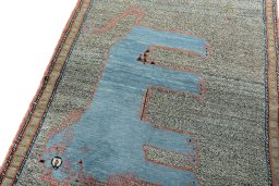 Backside of handmade New Persian Gabbeh rug showing knot structure and weave density