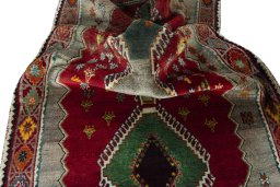 Corner detail of 2000s Persian Gabbeh rug showing border pattern and Wool pile
