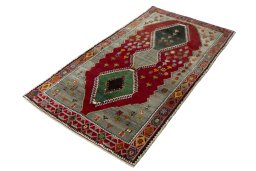 Corner detail of 2000s Persian Gabbeh rug showing border pattern and Wool pile