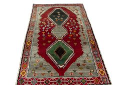 Surface texture of 2000s Persian Gabbeh rug with natural Wool and intricate pattern