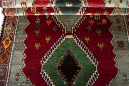 Full view of 2000s Persian Gabbeh rug from Iran / Persia, 225 × 123 cm in Red tones