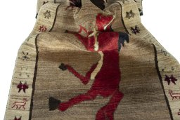 Corner detail of 2000s Persian Gabbeh rug showing border pattern and Wool pile