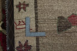 Close-up detail of 2000s Persian Gabbeh rug from Iran / Persia showing Wool weave