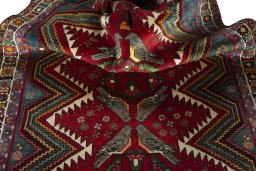 Corner detail of 2000s Persian Gabbeh rug showing border pattern and Wool pile