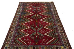 Surface texture of 2000s Persian Gabbeh rug with natural Wool and intricate pattern