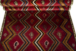 Full view of 2000s Persian Gabbeh rug from Iran / Persia, 234 × 111 cm in Red tones