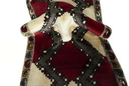 Corner detail of 2000s Persian Gabbeh rug showing border pattern and Wool pile