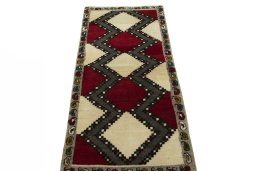 Surface texture of 2000s Persian Gabbeh rug with natural Wool and intricate pattern