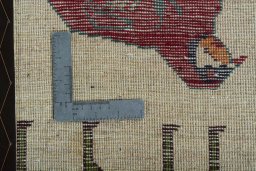 Corner detail of 2000s Persian Gabbeh rug showing border pattern and Wool pile