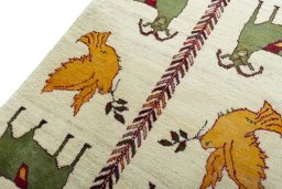 Backside of handmade 2000s Persian Gabbeh rug showing knot structure and weave density