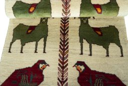 Full view of 2000s Persian Gabbeh rug from Iran / Persia, 174 × 78 cm in Beige tones