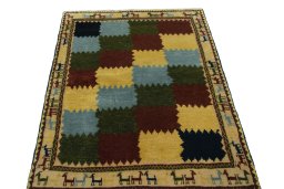 Surface texture of 2000s Persian Gabbeh rug with natural Wool and intricate pattern