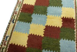 Backside of handmade 2000s Persian Gabbeh rug showing knot structure and weave density
