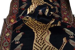 Corner detail of 2000s Persian Gabbeh rug showing border pattern and Wool pile