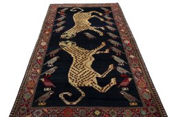 Surface texture of 2000s Persian Gabbeh rug with natural Wool and intricate pattern