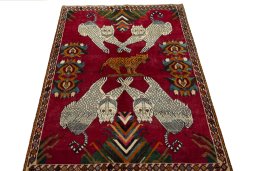 Surface texture of 2000s Persian Gabbeh rug with natural Wool and intricate pattern